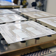 The displays are printed one layer at a time on films. They must be left to dry between each step.