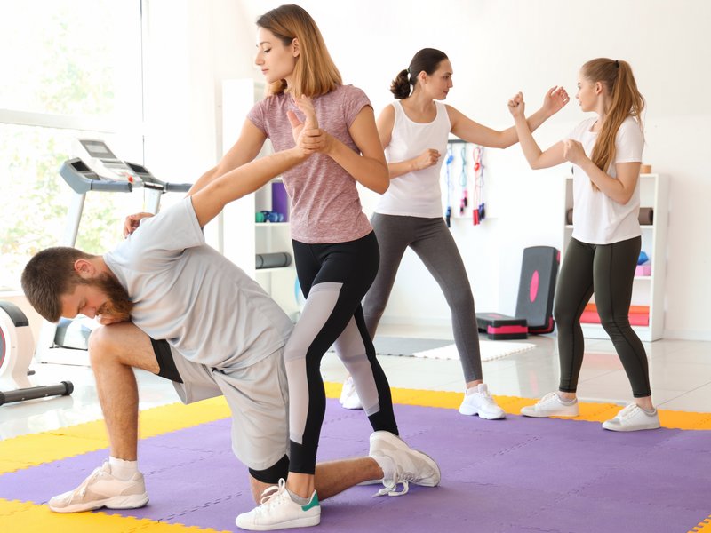 Young women attending self-defence courses in gym